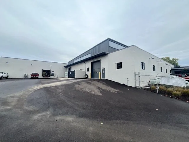 View of the facility exterior with additional service bays